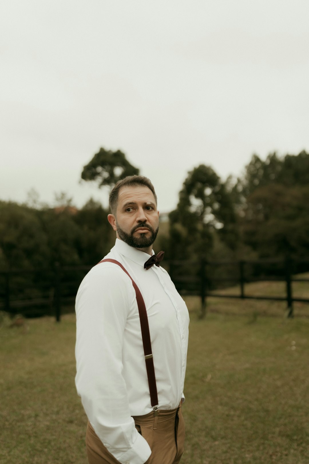 Studio portrait of a European man in his 30s with a short beard wearing a sweater